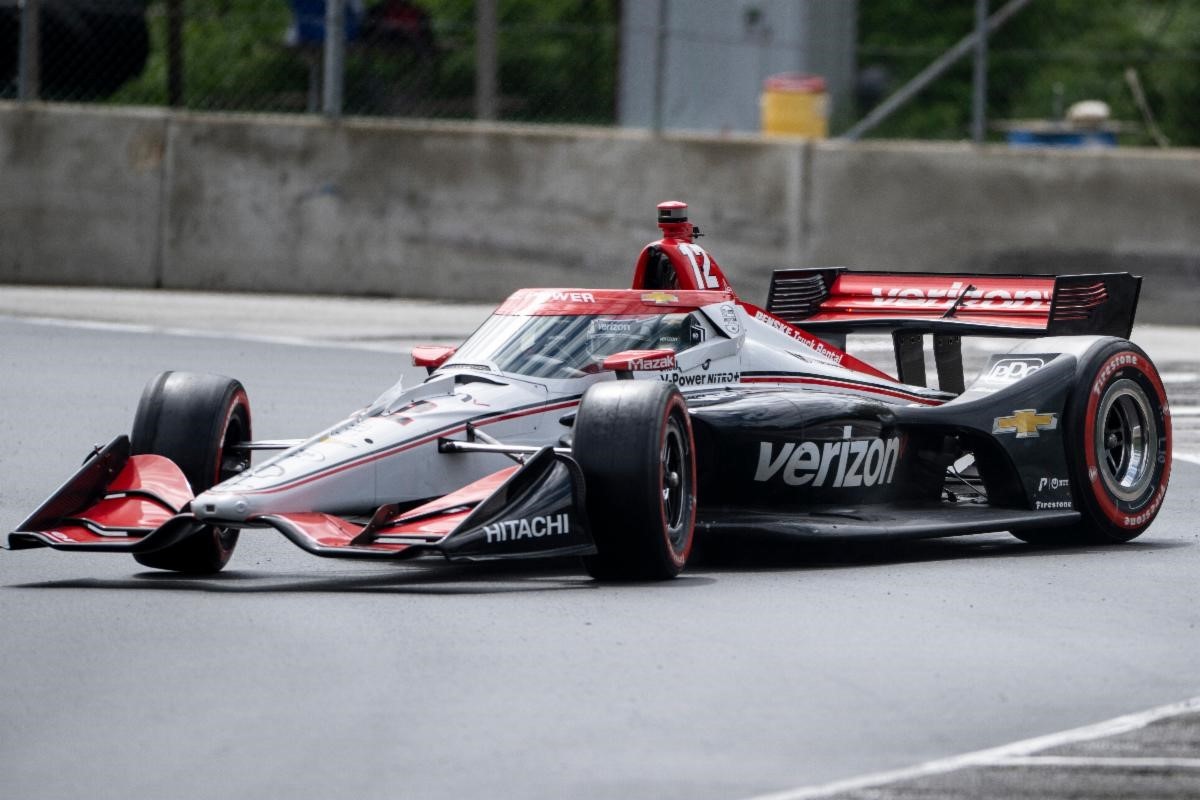 A front 3/4 view of the No. 12 Team Penske Chevrolet, driven by Will Power, on track at Road America.