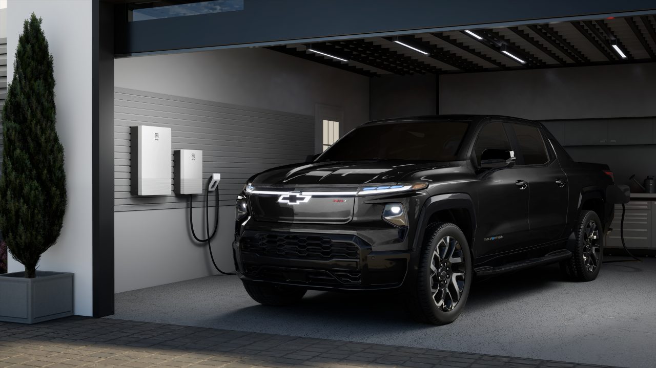 A 2024 Chevrolet Silverado EV RST plugged into GM Energy’s bidirectional charger. 