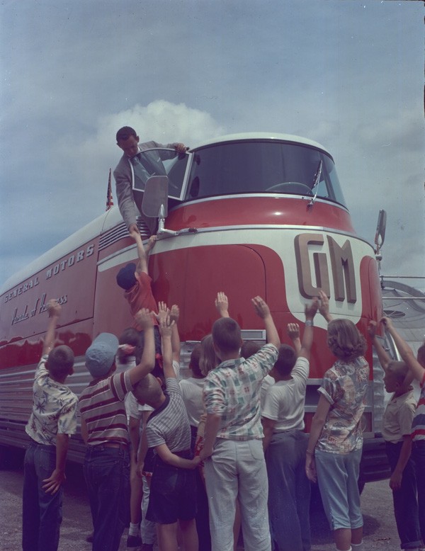 Children waving to the driver during the early 1950s Parade of Progress