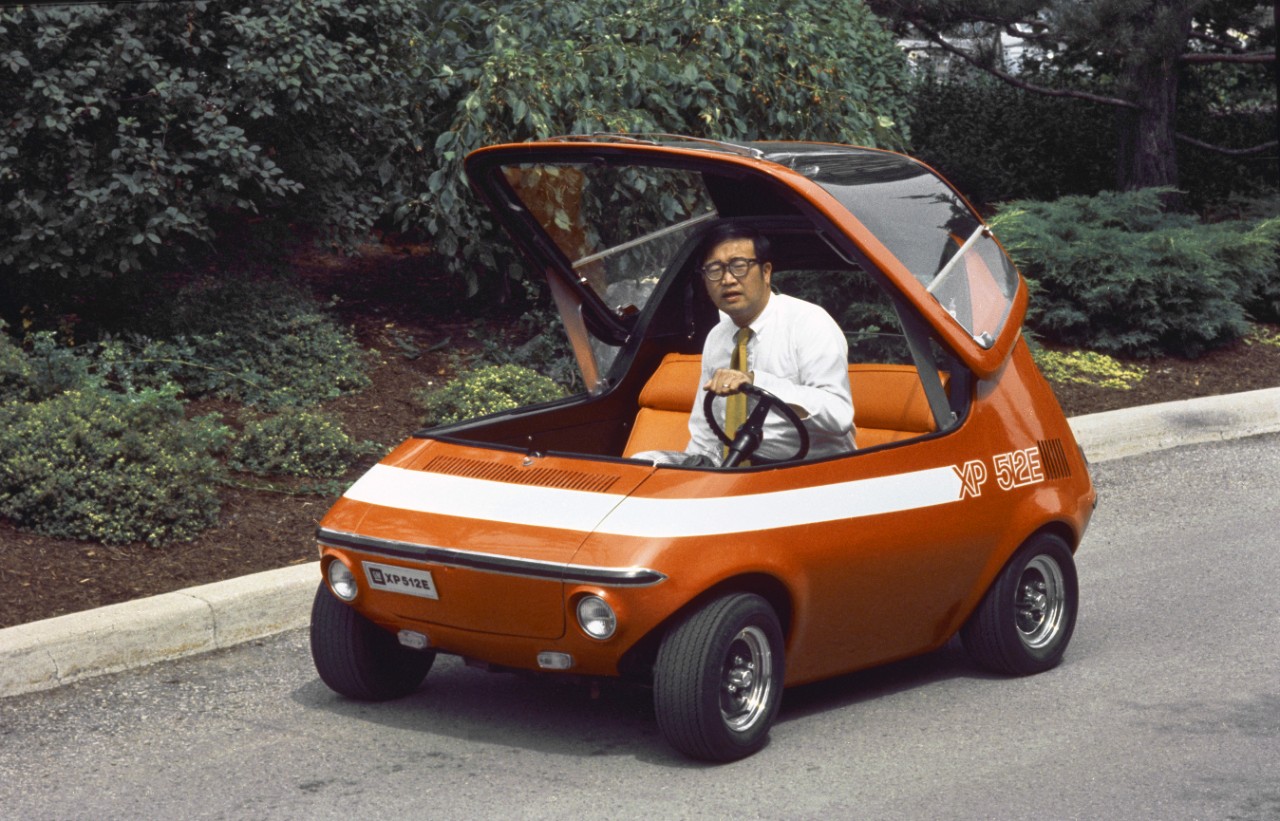 A GM engineer sits in the 512E with the canopy top raised.