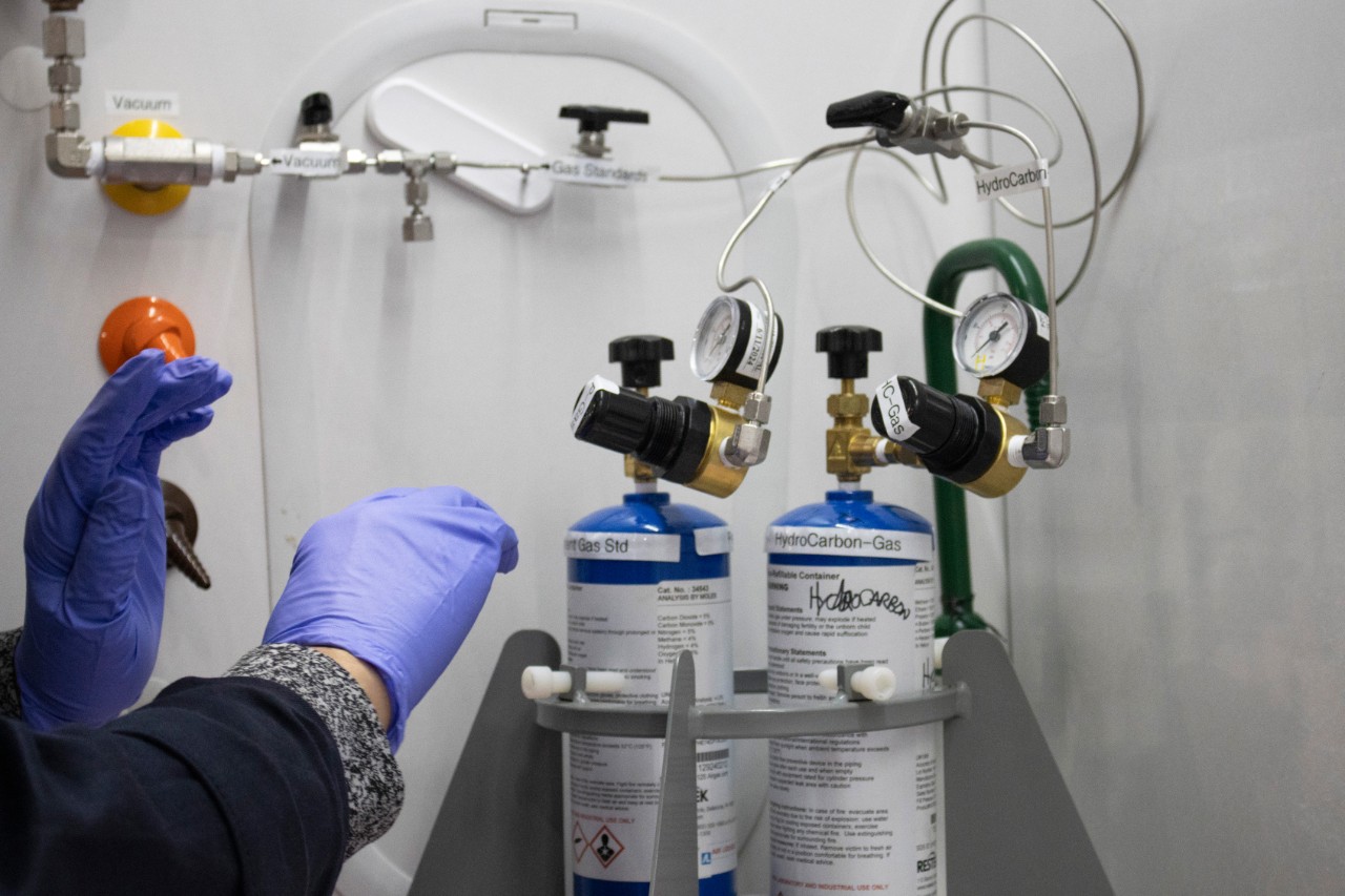  Inorganic analytical chemist Ty Triplett calibrates a gas chromatograph in preparation to analyze battery gases