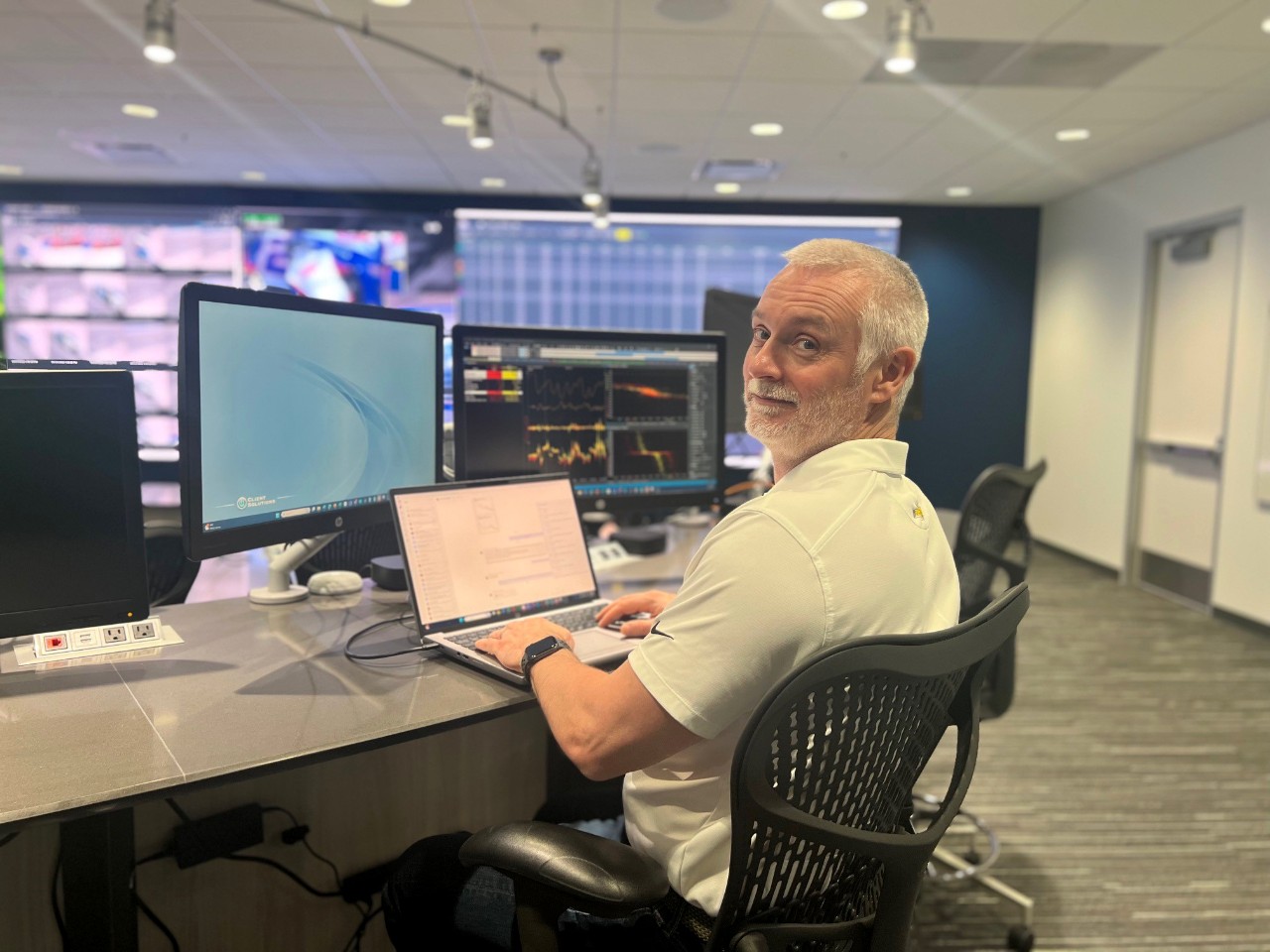 Anthony Heenan sitting at his desk looking at the camera.