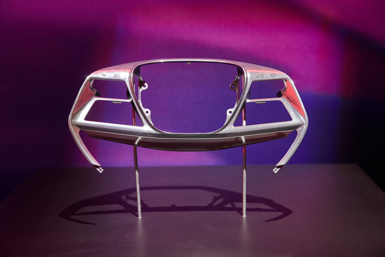 Cadillac Unveils 2024 CELESTIQ Flagship Sedan A metal steering wheel part on stand