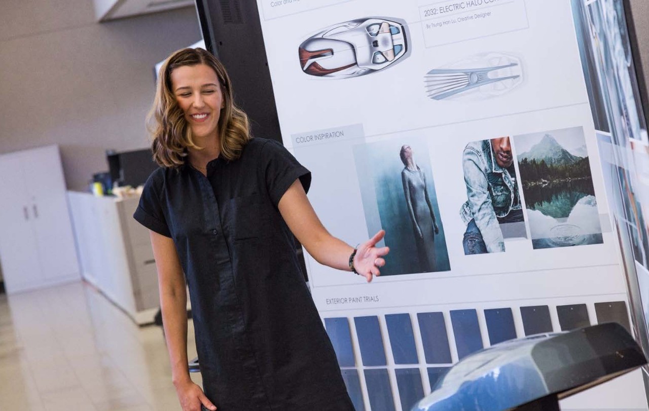 A woman giving a presentation.