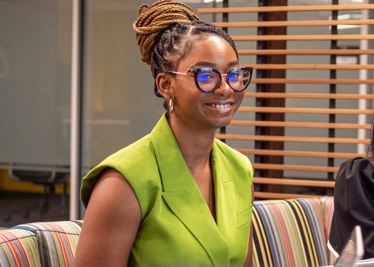 A man standing in front of a desk.