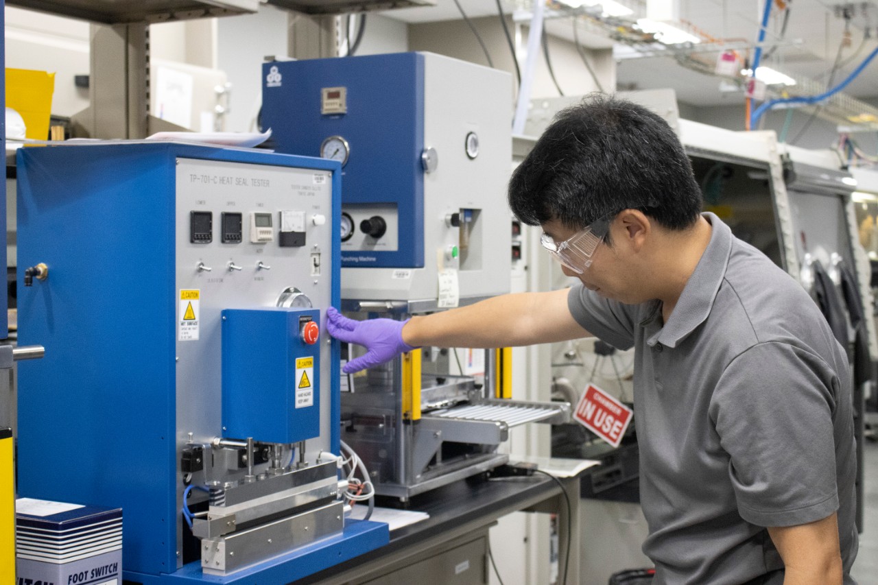 Man standing next pickup truck.