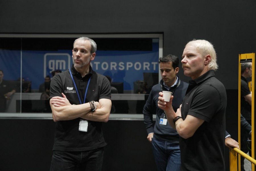 Men standing in white room