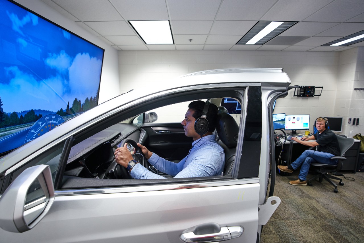 Kapadia testing preliminary sound design functions using a simulator in the GM sound design studio. 
