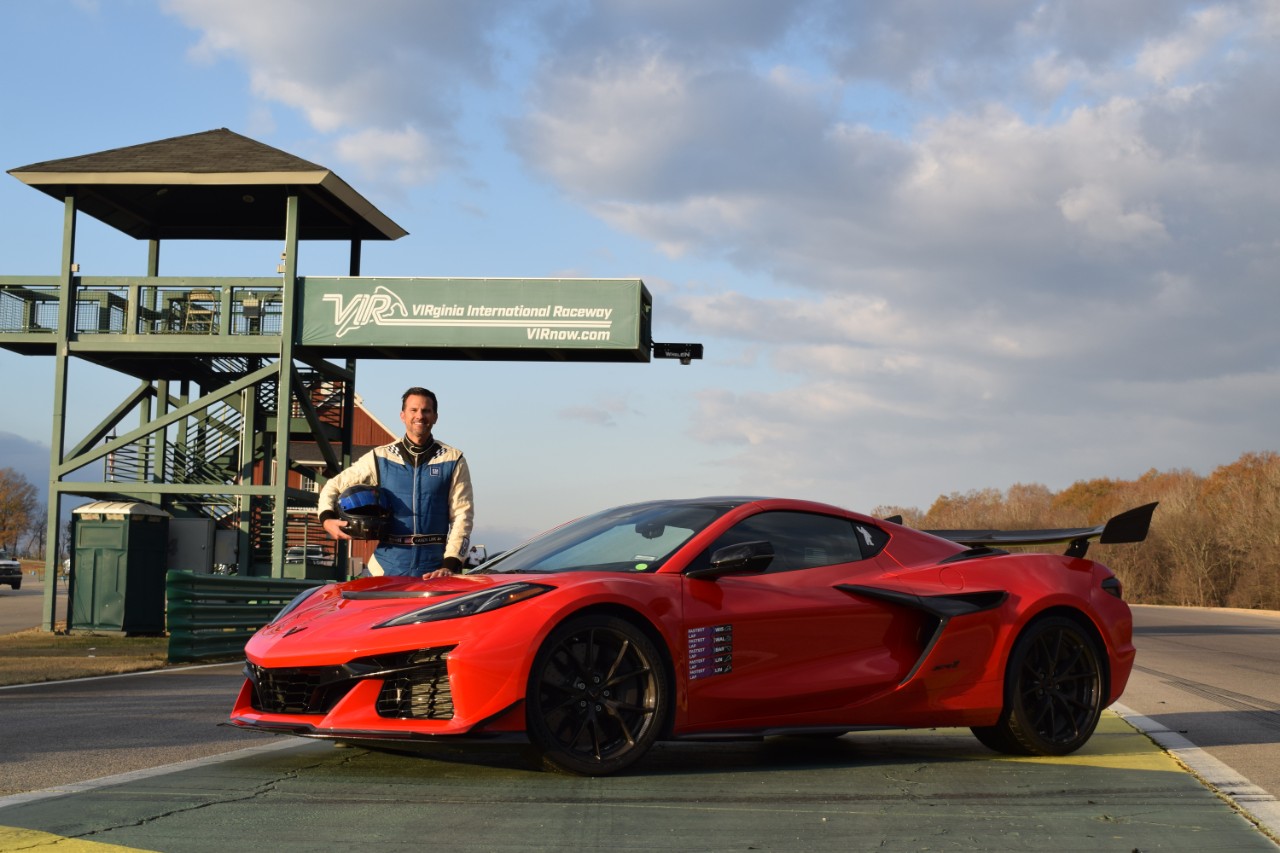 Aaron Link, global vehicle performance manager of Chevrolet Performance Cars, stands with the Corvette ZR1