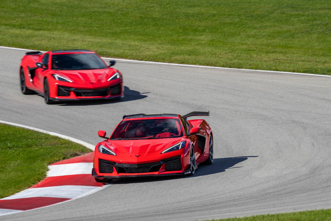 Two red corvettes on track