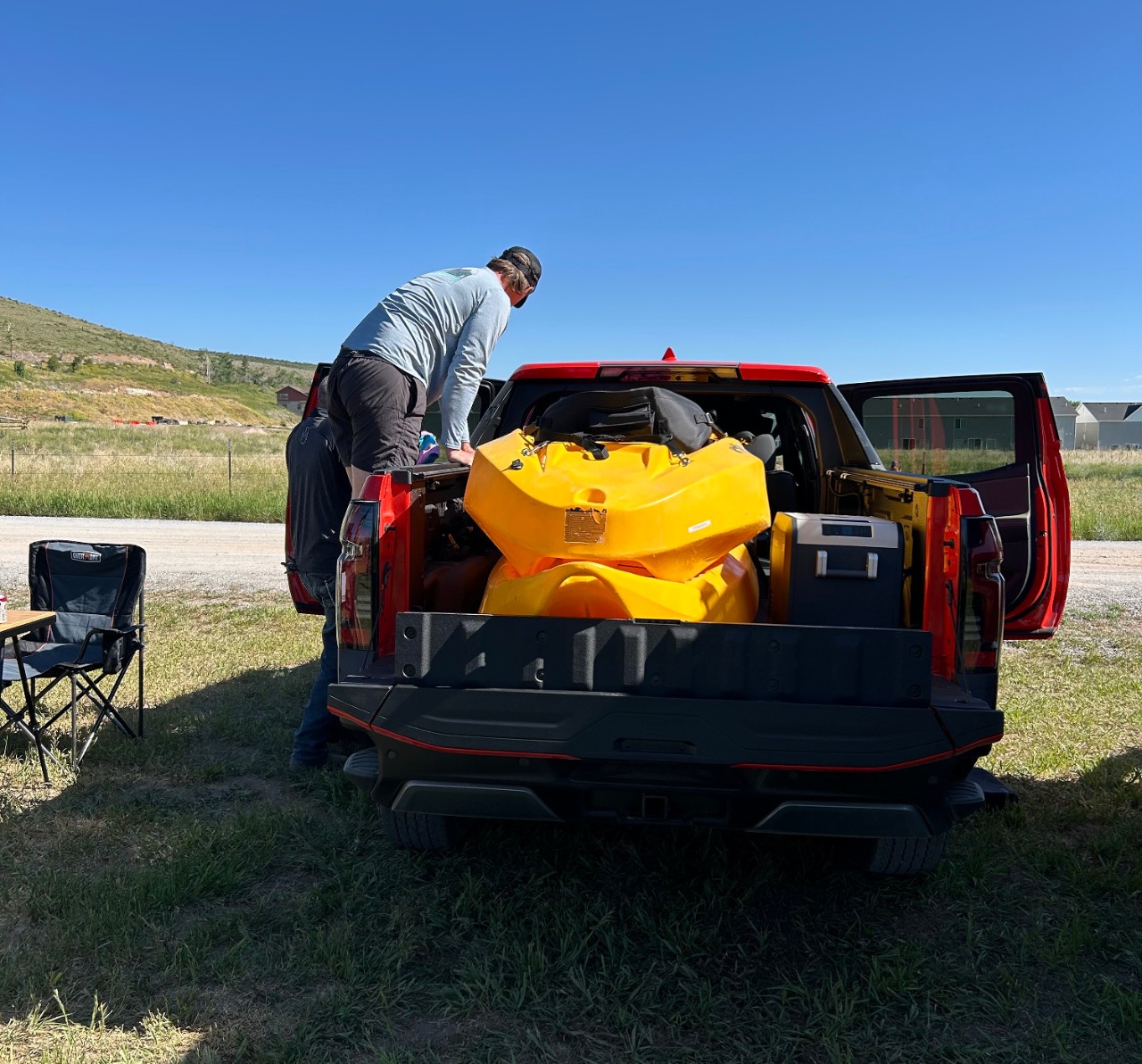 A Cadillac LYRIQ behind an EF Pro Cycling rider.