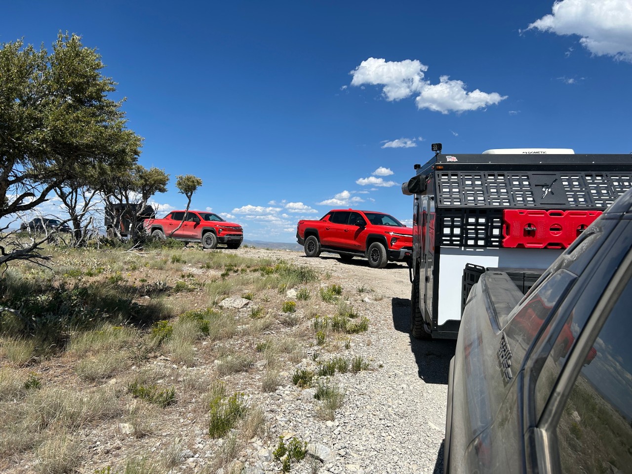 A Cadillac LYRIQ behind an EF Pro Cycling rider.