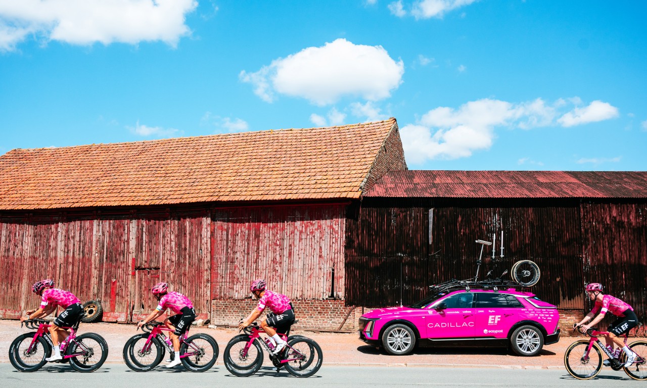 Pink Cadillac LYRIQ with EF Pro Cycling team.