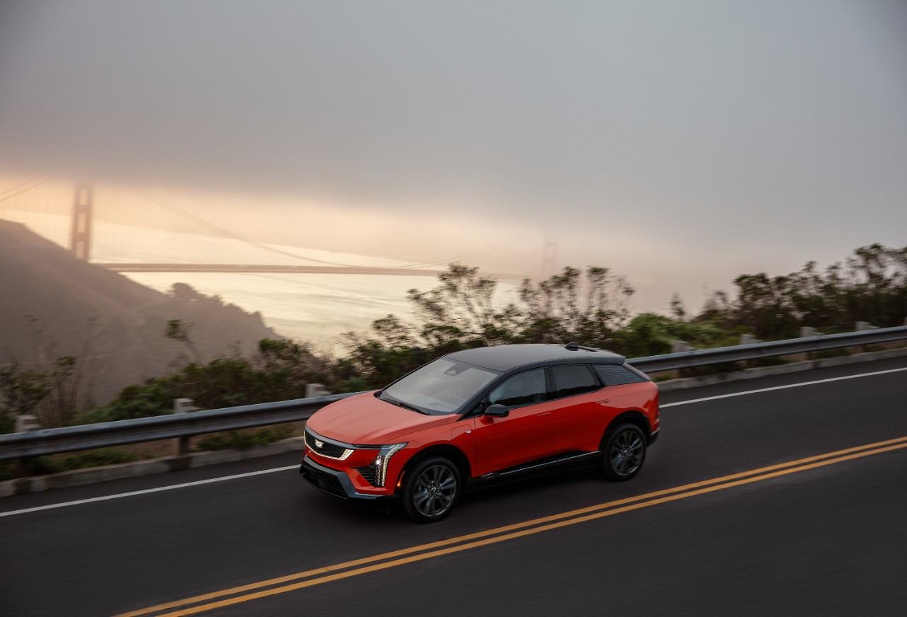 A 2025 Cadillac OPTIQ on the road near the Golden Gate Bridge in California