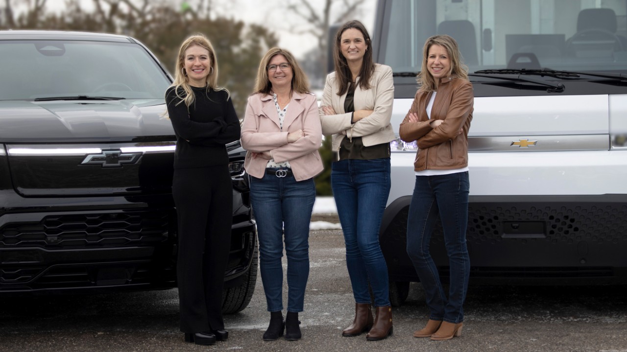 GM chief engineers Marisa Cullens Kathy Gillespie Joan Petit and Kristin Cermak in front of black Chevy Silverado EV