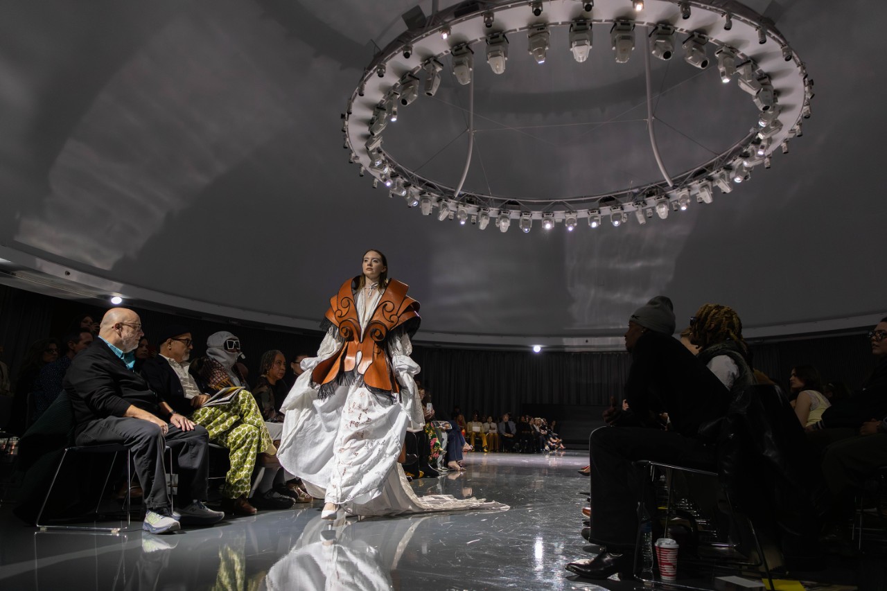 Fashion model on the runway in white dress