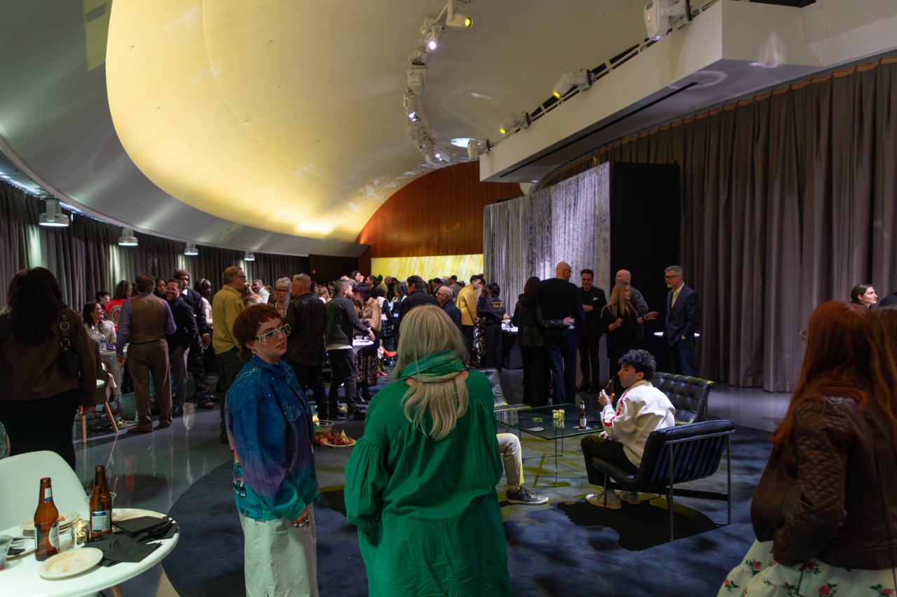 Party attendees in the lobby of the GM Design Dome.