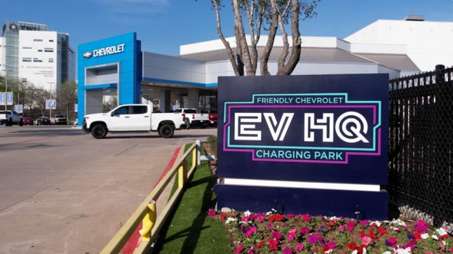 An EV HQ charging station sign at Friendly Chevrolet