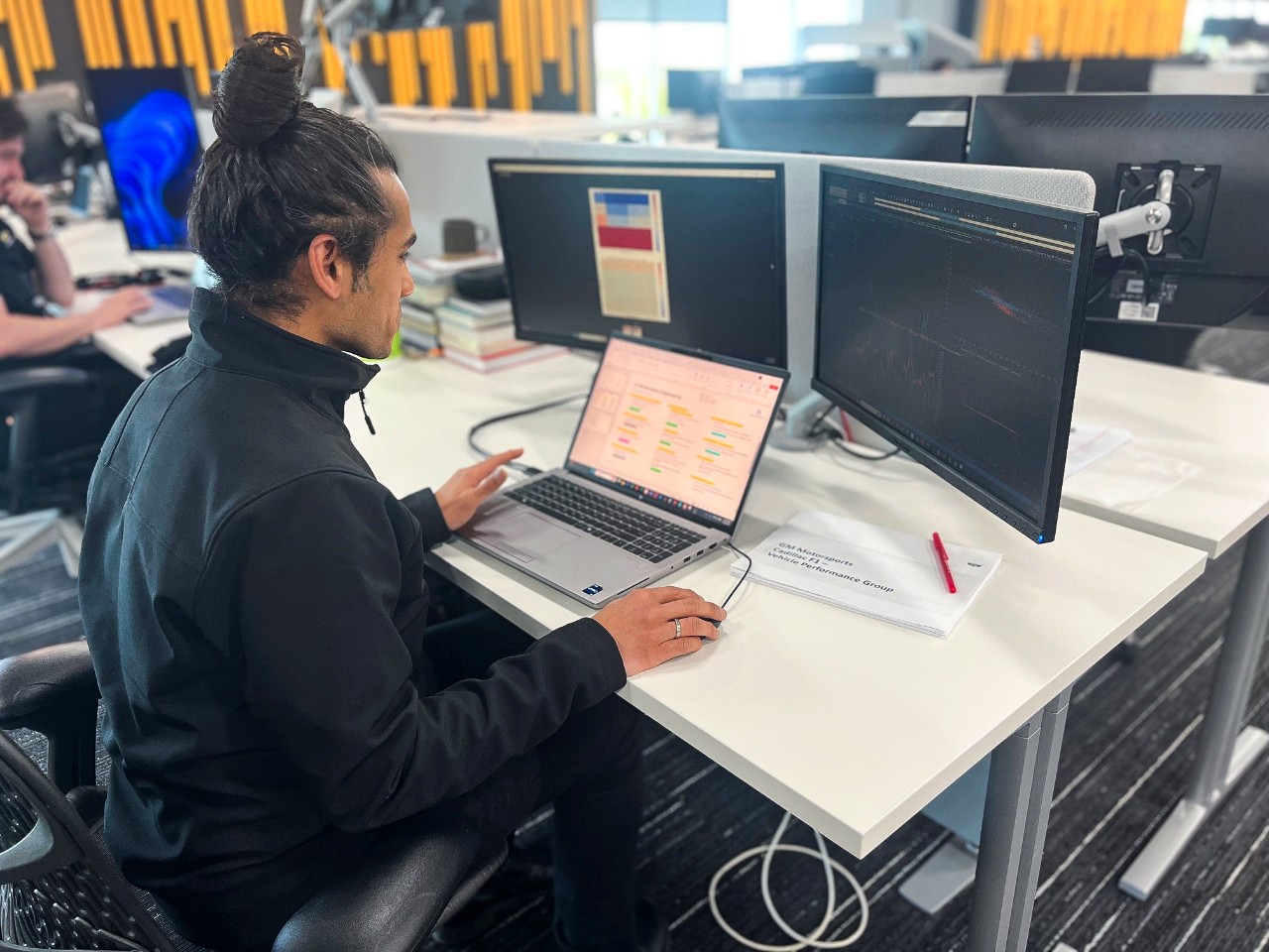Man working on a computer in an office.