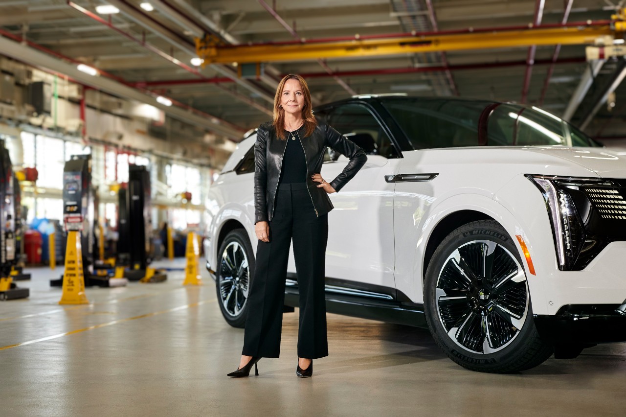 Mary Barra in front of white car