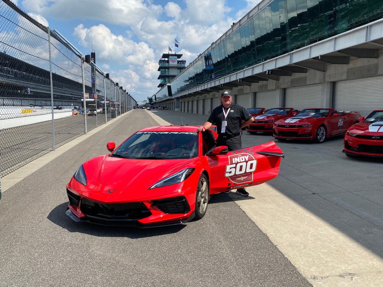 GM Senior VP Ken Morris with a red Corvette Stingray at the 2020 Indy 500