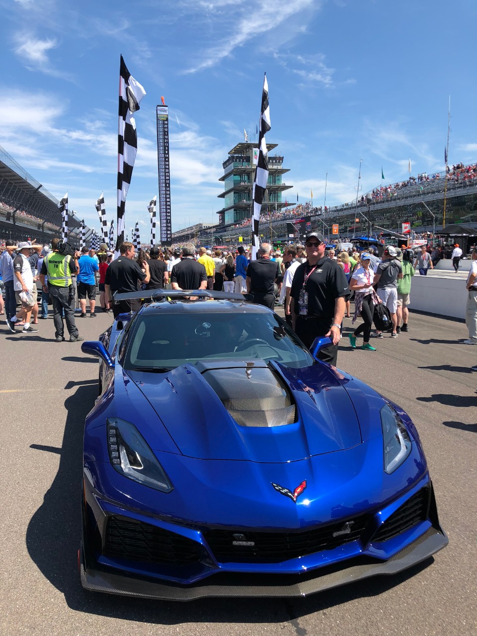 Ken Morris with a blue Corvette at the Indianapolis Motor Speedway