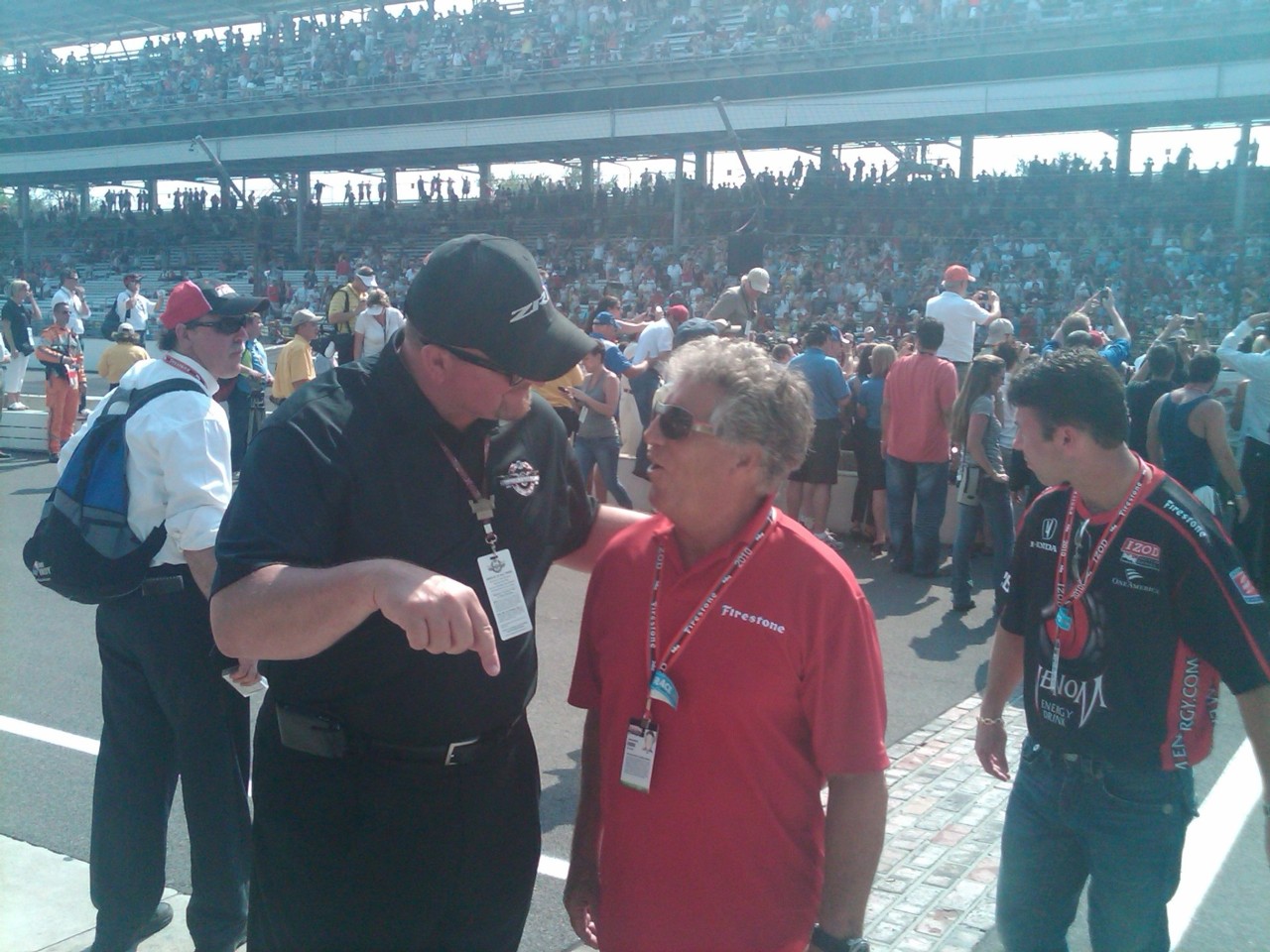 GM Senior VP Ken Morris with a blue Corvette at the Indianapolis Motor Speedway.