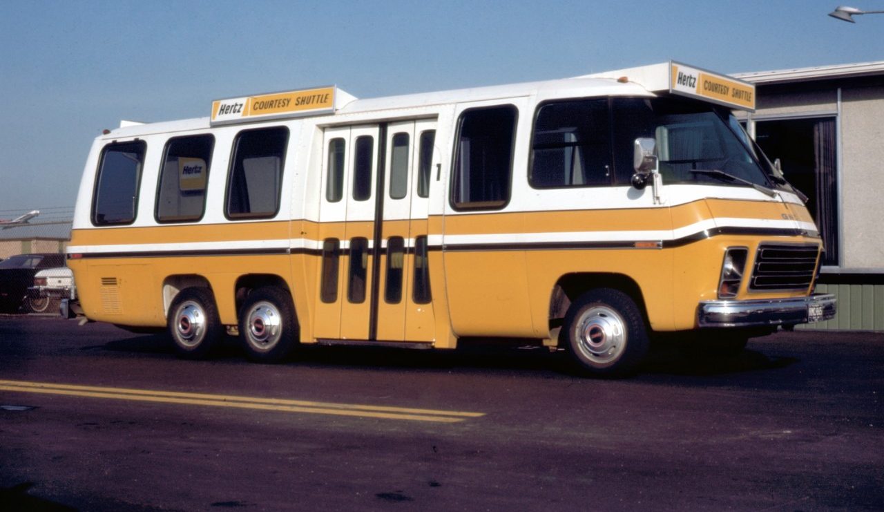 GMC Motorhome configured as a rental-car shuttle bus.