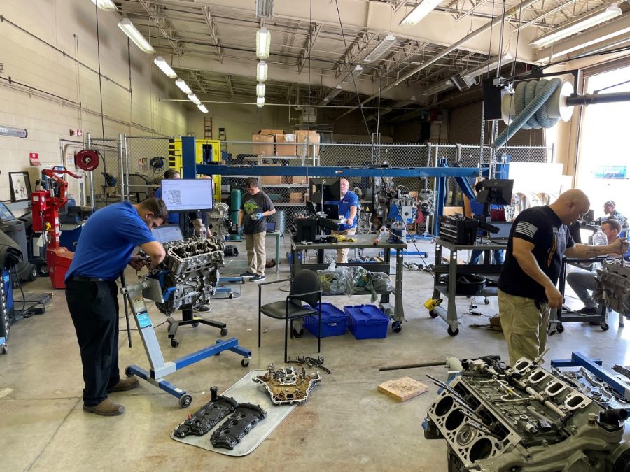 Army members learn automotive service techniques