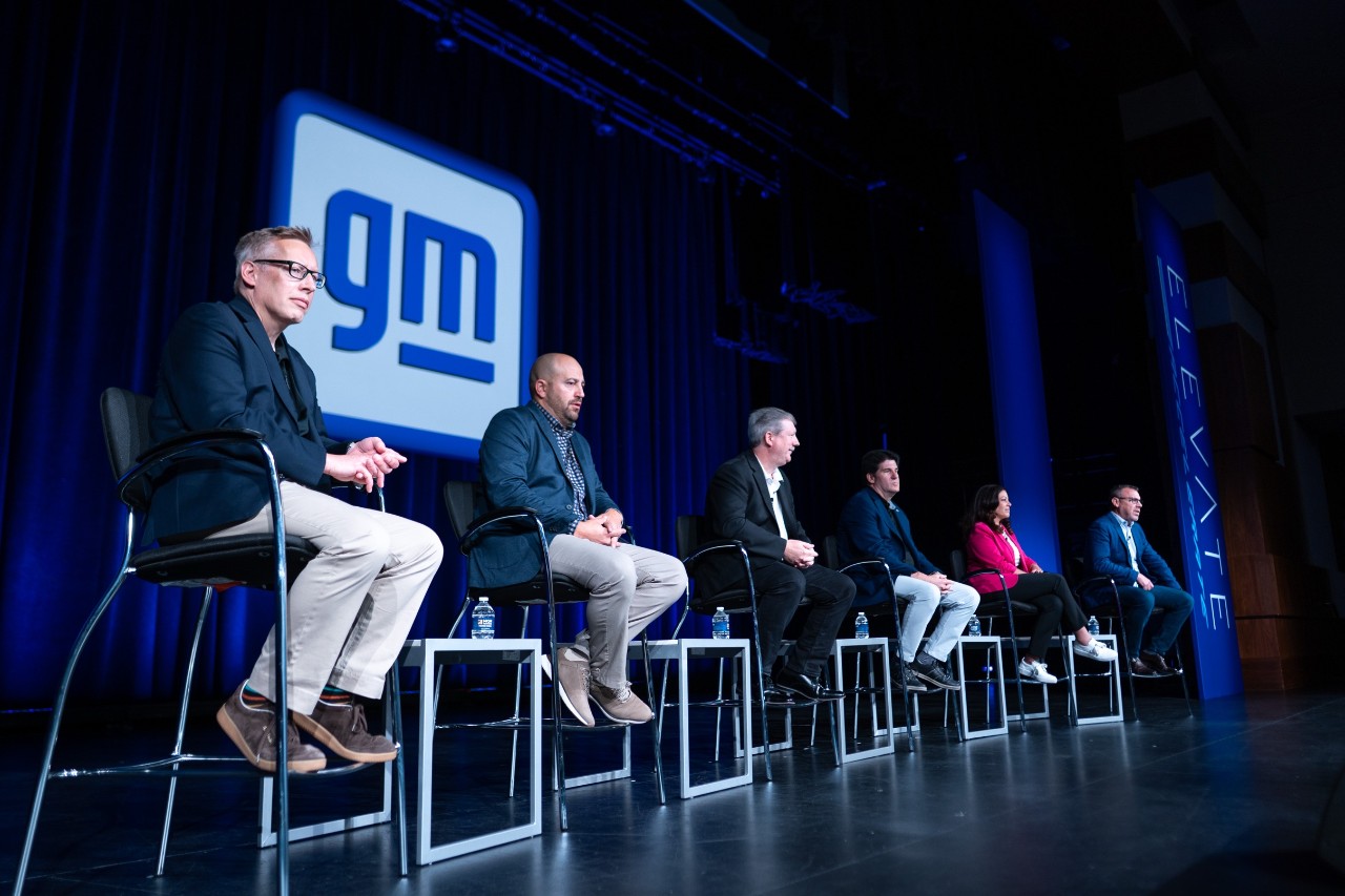 Ian Hucker (left) on stage at a recent professional development event Sterling Anderson visits GM's Factory Zero, in Detroit