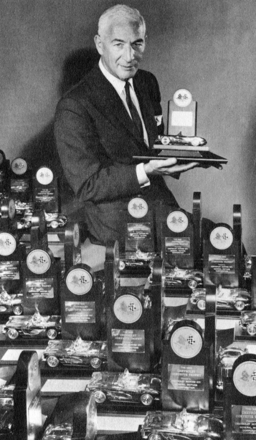 Taken in 1962, this photo shows Zora Arkus-Duntov with Chevrolet  Corvette trophies.