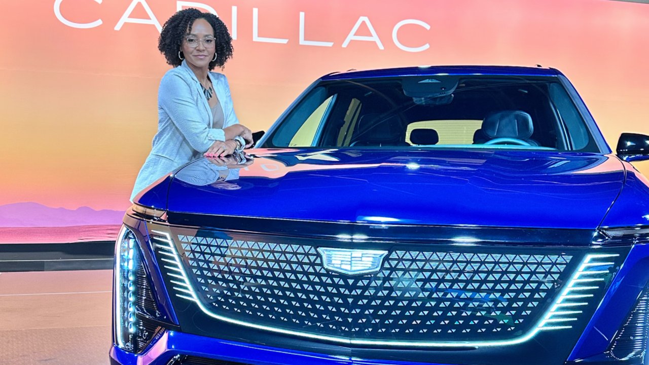 Elisha Brown, GM senior quality engineer, with a Cadillac Vistiq