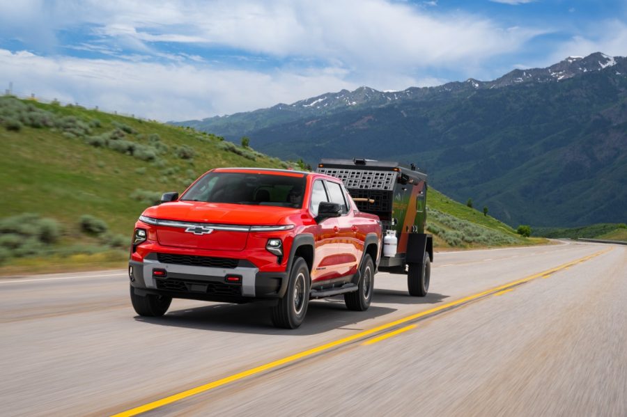 2026 Silverado EV Trail Boss towing a camper.
