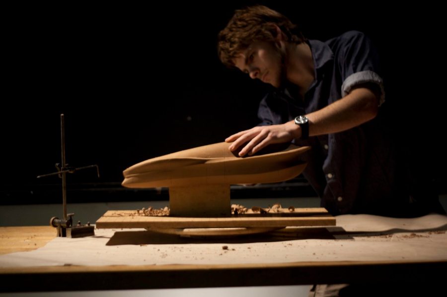 Designer with clay model