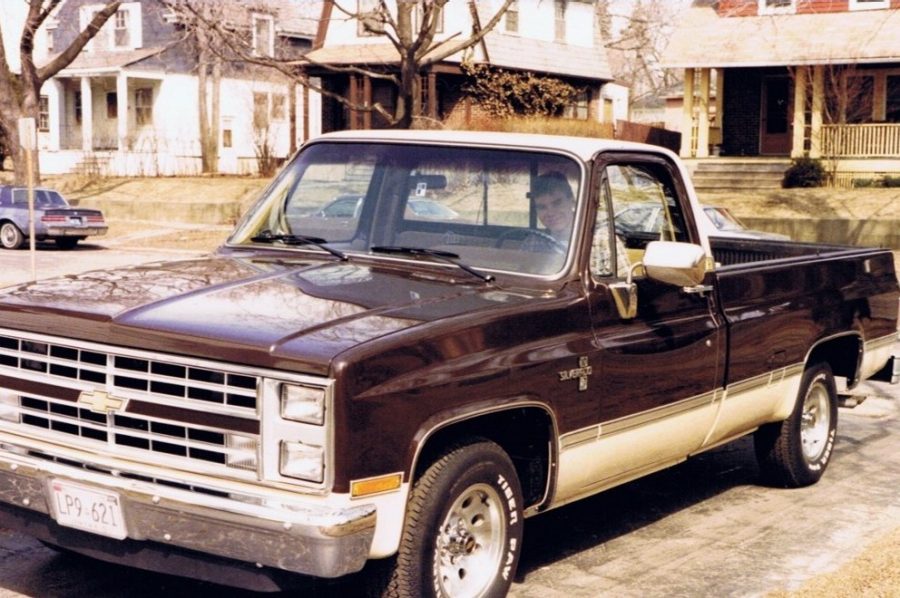 Vintage photo, man in brown pickup truck