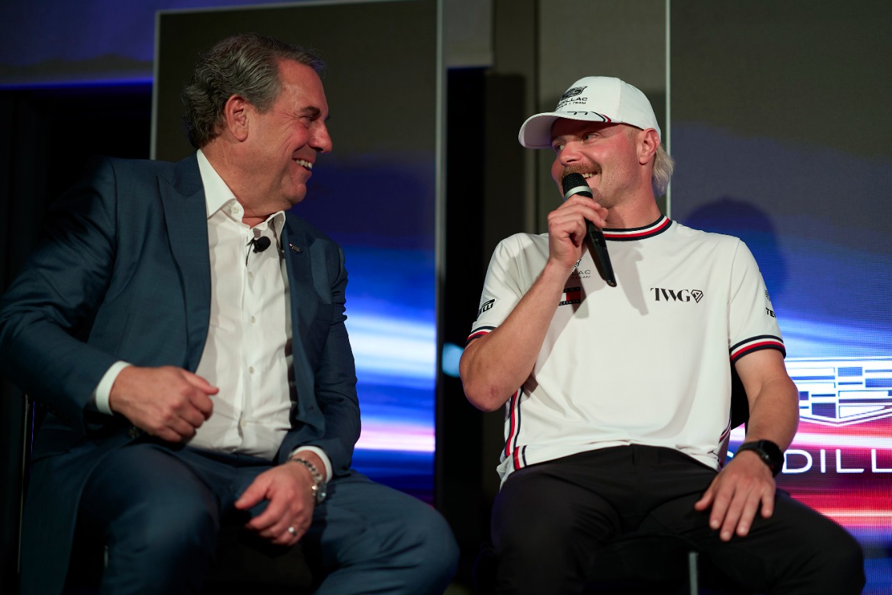 Mark Reuss and Cadillac F1 driver Valtteri Bottas share a laugh
