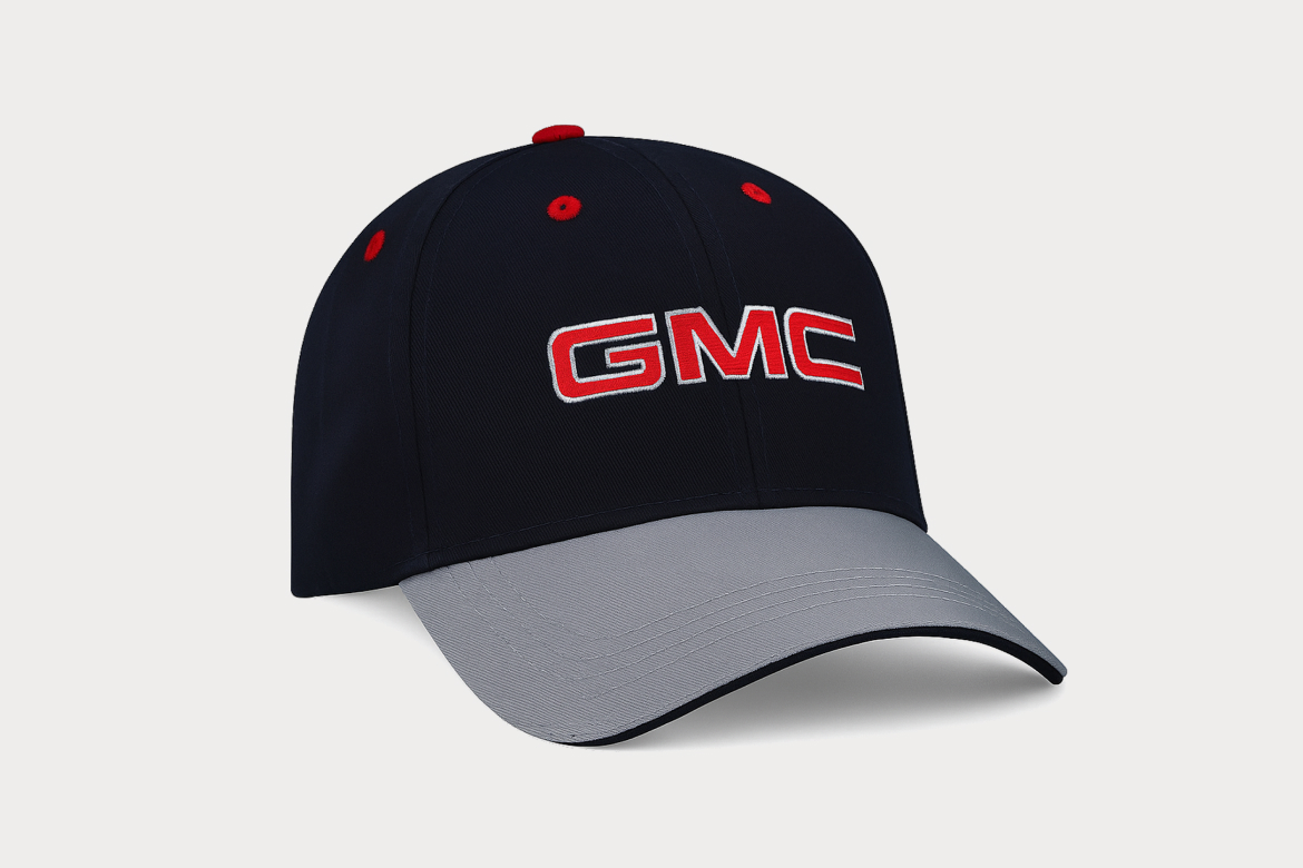 Dark Blue Baseball Cap with Gray Brim and Black Cap. Red GMC logo on Front.