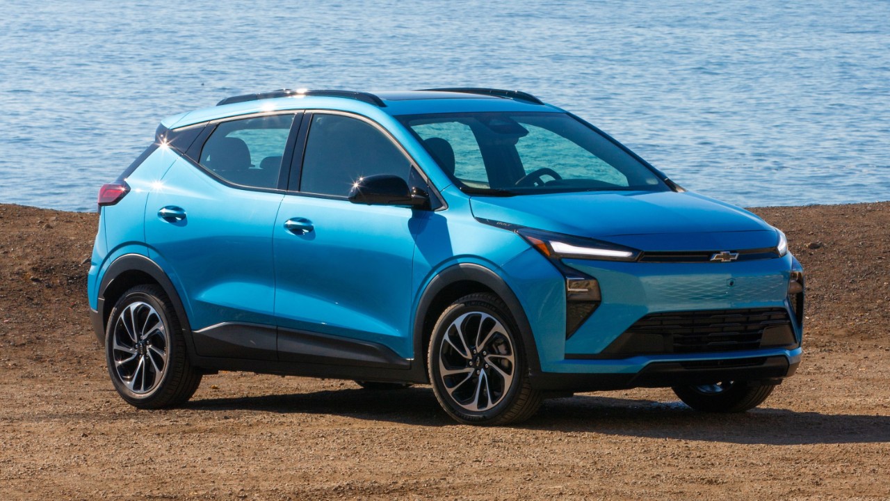 2027 Chevrolet Bolt in blue on highway