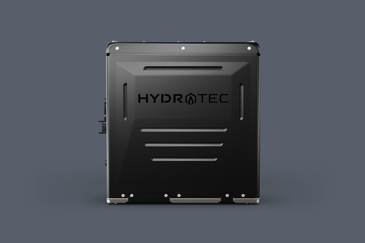 Front view of a hydrogen fuel cell power cube, featuring a matte black exterior with the HYDROTEC logo centered on the panel.